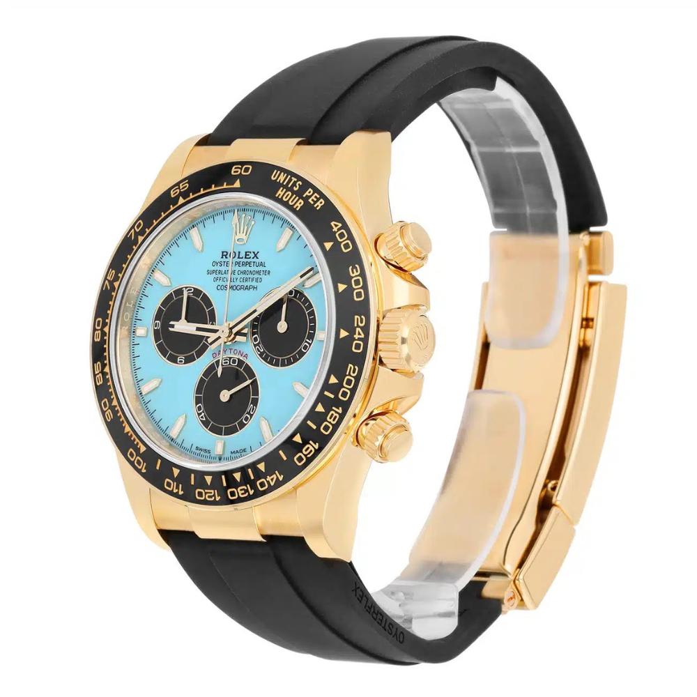 Chronograph, gold case, black bezel, turquoise dial with black sub-dials, black rubber strap