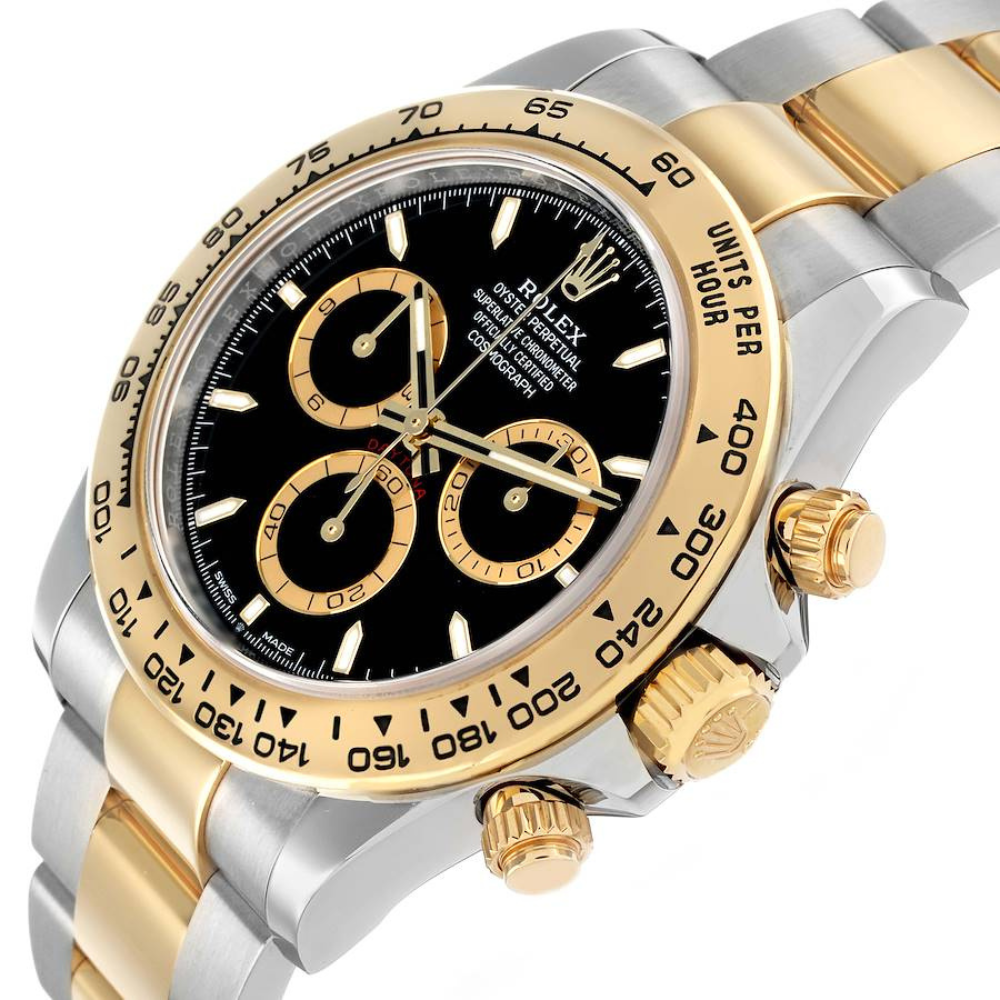 Two-tone steel and gold, gold bezel, black dial with gold accents