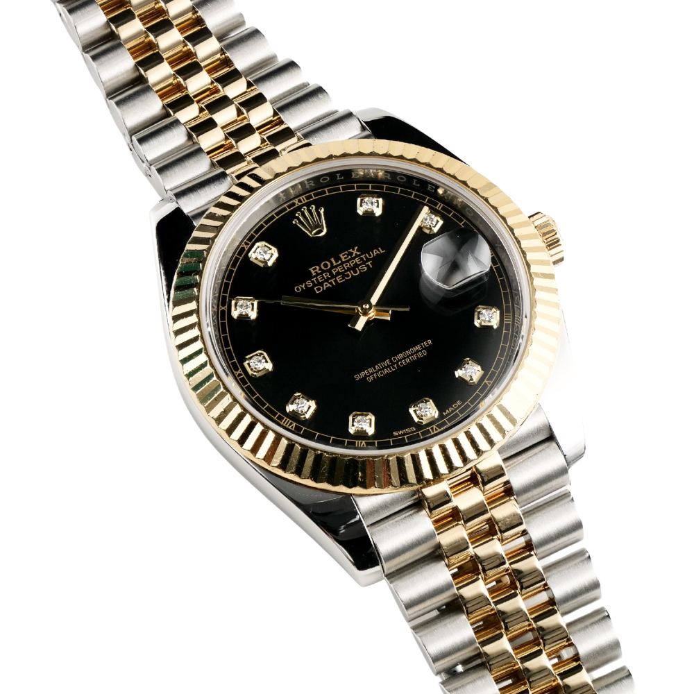 Two-tone, gold octagonal bezel with screws, black dial