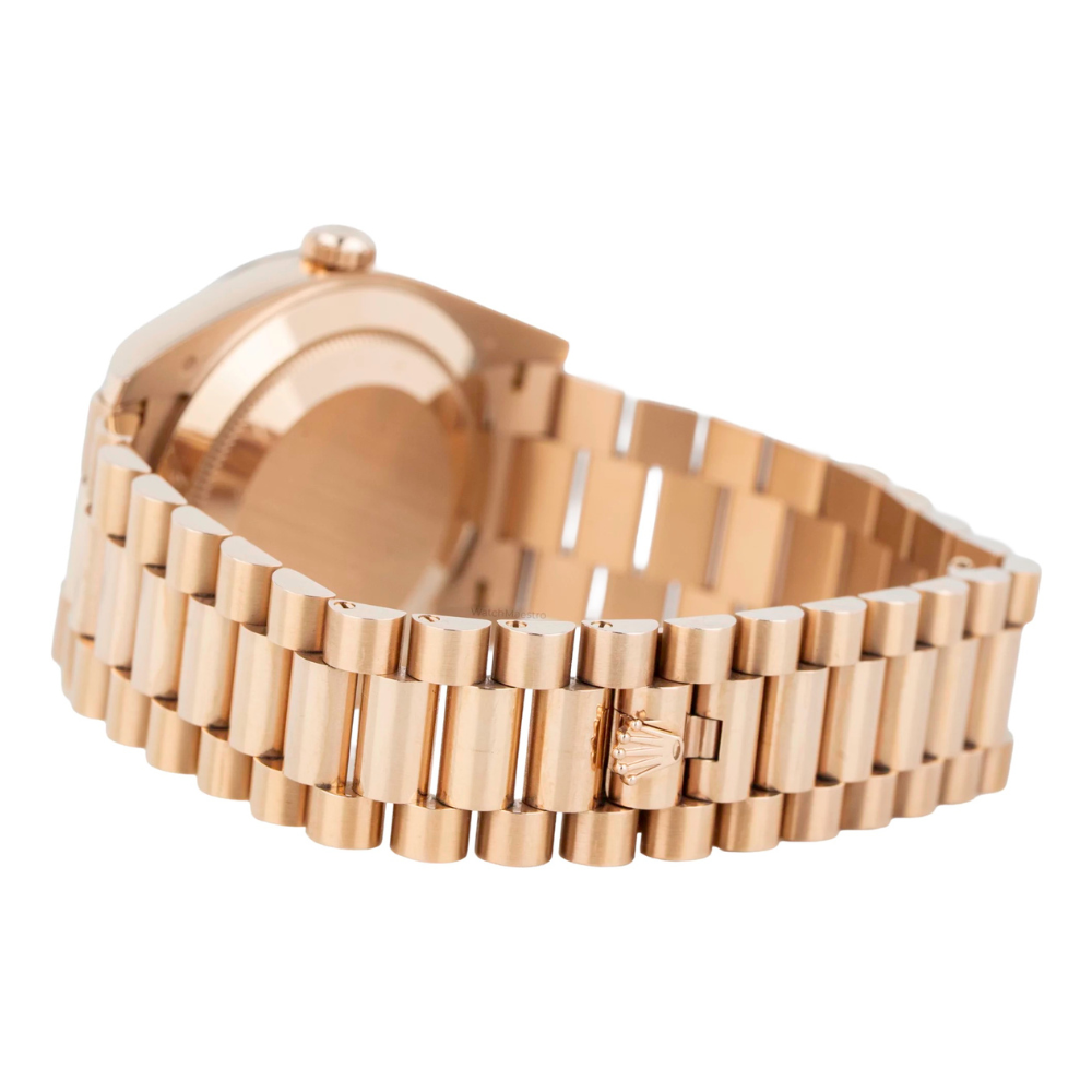 Full rose gold, wide polished bezel, green sunburst dial