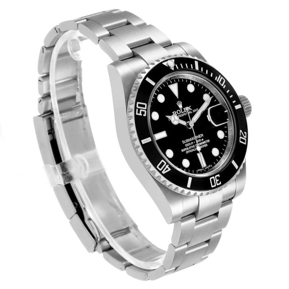 Rounded octagonal case with side ears, steel, black dial, integrated bracelet