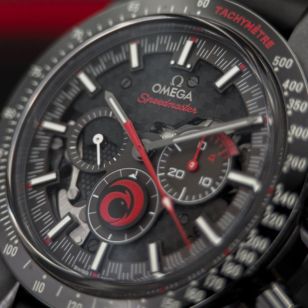 All-black chronograph with red accents