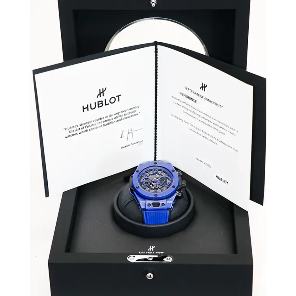 Angular blue and black sport case, skeleton dial with blue accents, blue rubber strap