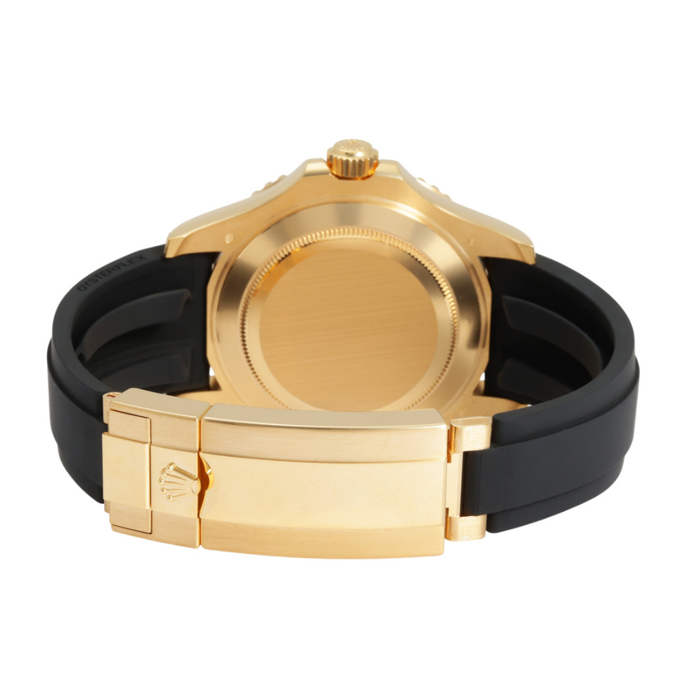 Gold case with black octagonal bezel, black dial, black rubber strap
