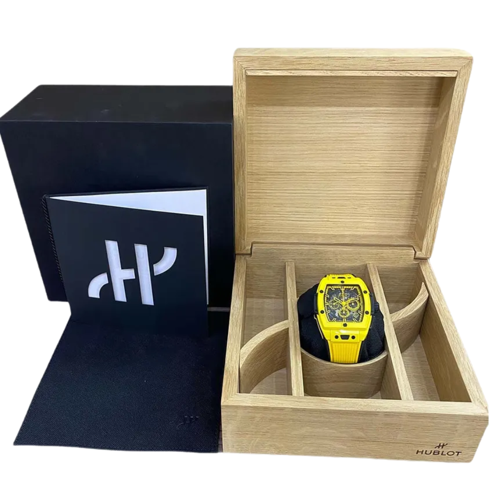 Sporty black and yellow tonneau, skeleton dial, yellow rubber strap