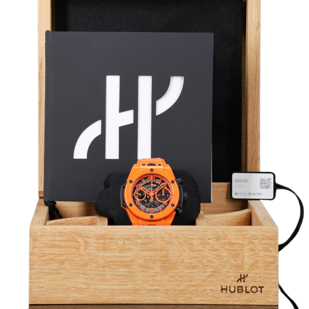 Sporty black and orange tonneau, skeleton dial, orange rubber strap